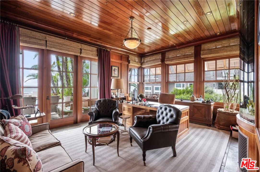 212 The Strand Manhattan Beach, CA 90266 - Photo 6 of 74 a living room with furniture and floor to ceiling windows