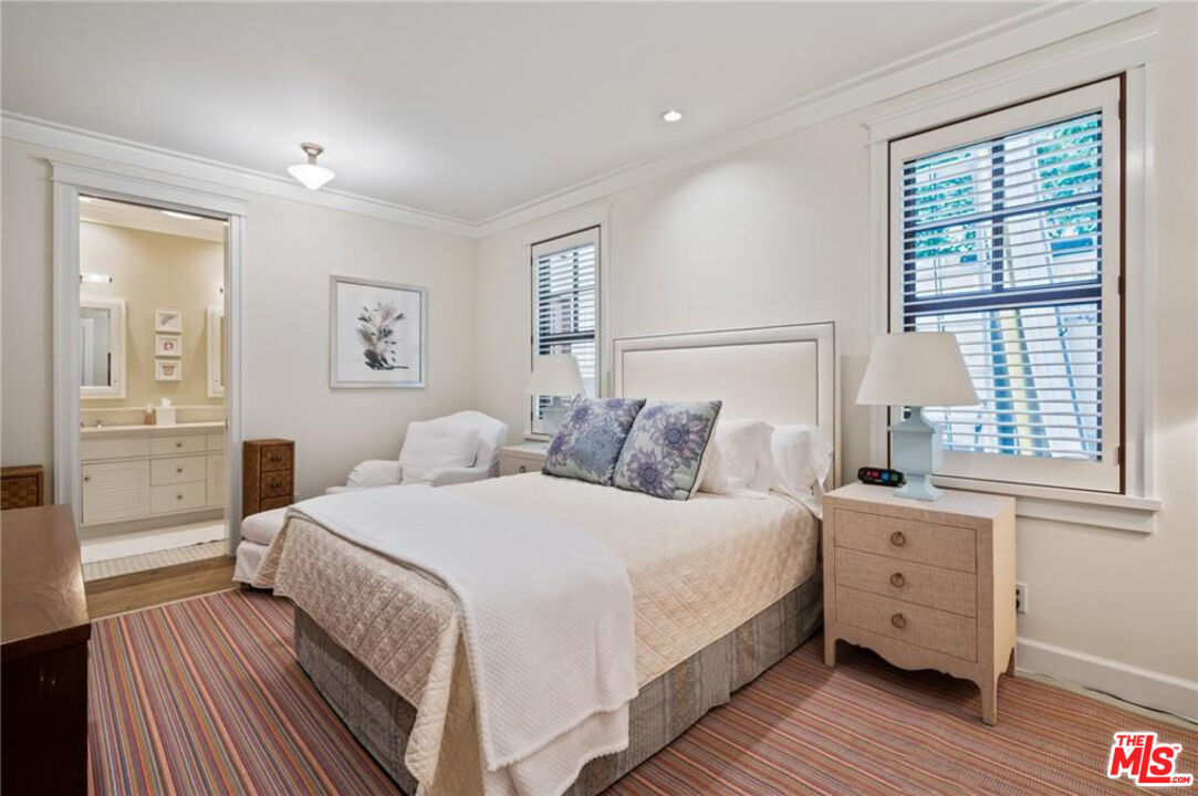 212 The Strand Manhattan Beach, CA 90266 - Photo 64 of 74 a bedroom with a bed and a window
