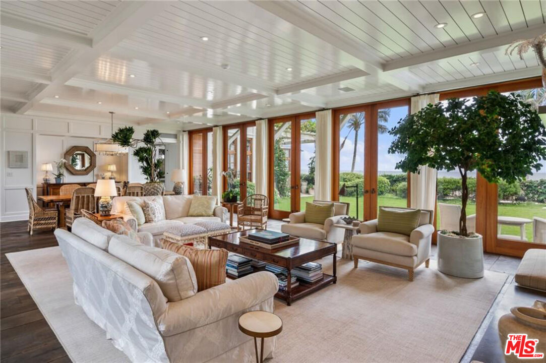 212 The Strand Manhattan Beach, CA 90266 - Photo 7 of 74 a living room with furniture and large windows