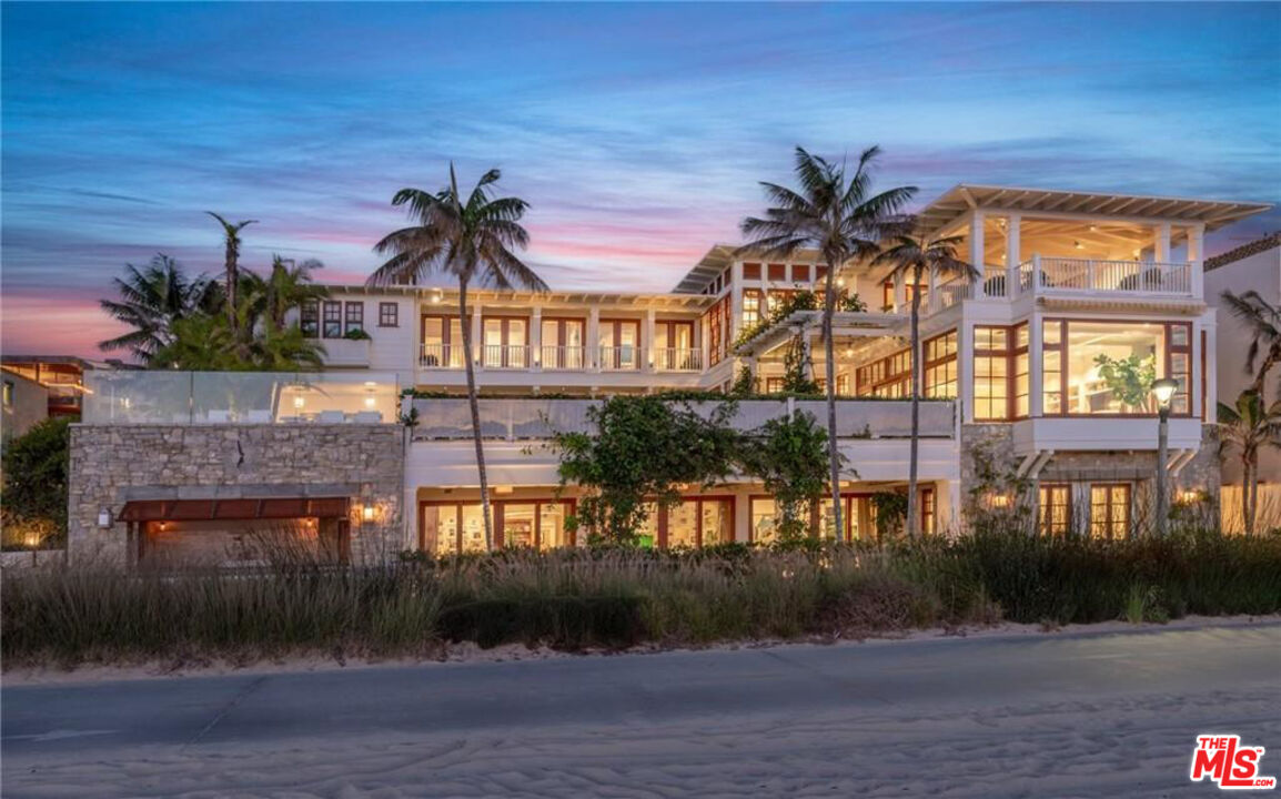 212 The Strand Manhattan Beach, CA 90266 - Photo 72 of 74 a front view of a house with a yard