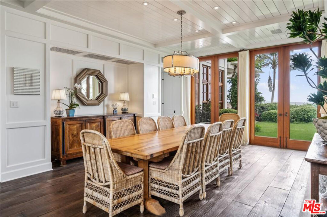212 The Strand Manhattan Beach, CA 90266 - Photo 10 of 74 a dining room with furniture a chandelier and wooden floor