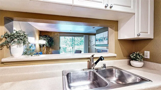 a kitchen with a sink and a window