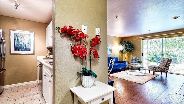 a living room with furniture and flowers