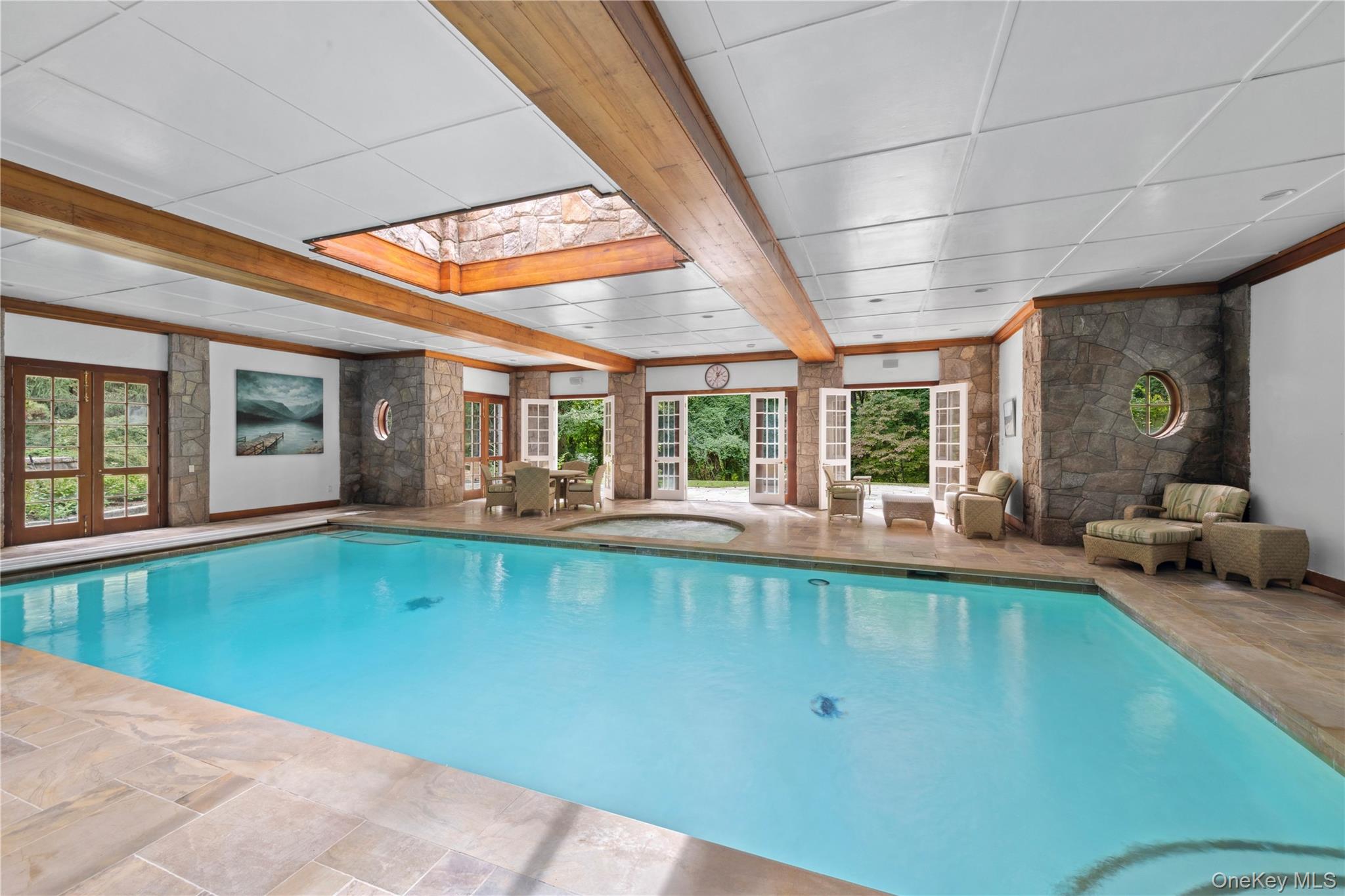 284 West Patent Road Bedford, NY 10549 - Photo 26 of 40 Indoor pool featuring a skylight
