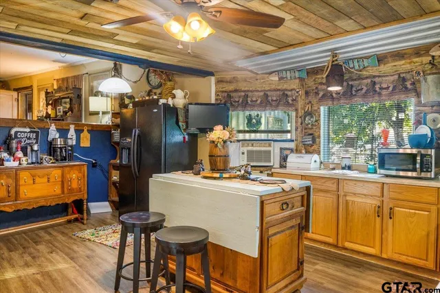a kitchen that has a cabinets and a stove in it