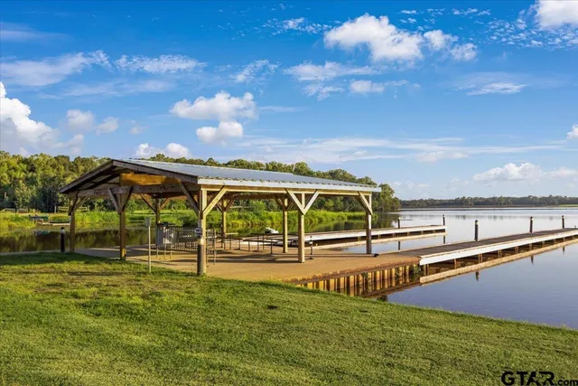 a view of swimming pool with an outdoor seating