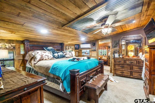 a bedroom with bed and storage