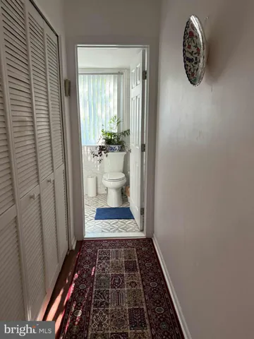 a bath room with a rug and a rug
