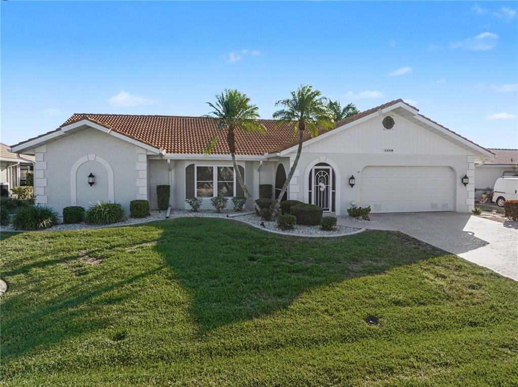 1119 Vía Formia Punta Gorda, FL 33950 - Photo 14 of 58 a view of a house with a yard