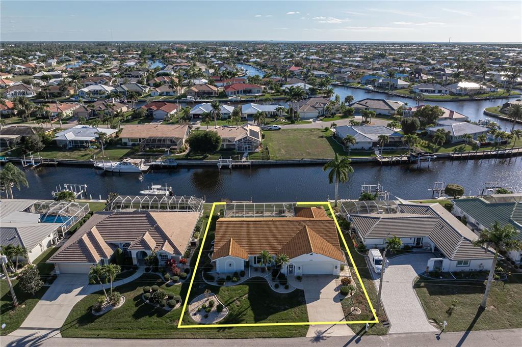 1119 Vía Formia Punta Gorda, FL 33950 - Photo 15 of 58 an aerial view of a house with sitting space and water view