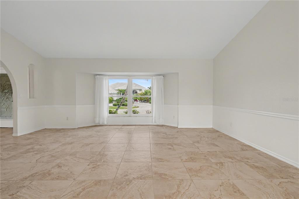 1119 Vía Formia Punta Gorda, FL 33950 - Photo 22 of 58 an empty room with window and ceiling fan