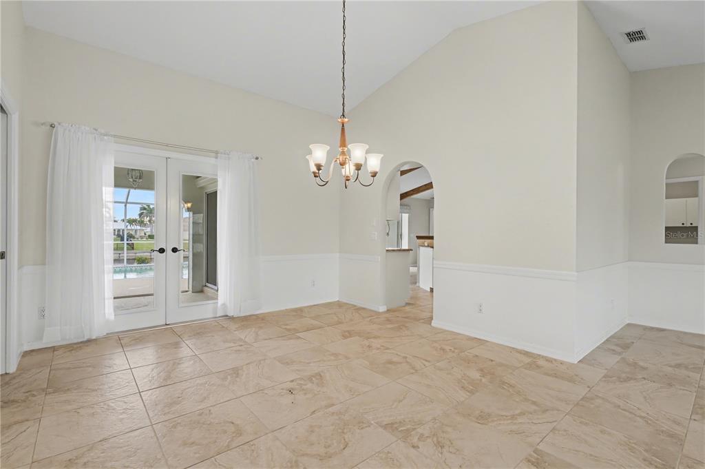 1119 Vía Formia Punta Gorda, FL 33950 - Photo 24 of 58 a view of a chandelier in big room and chandelier