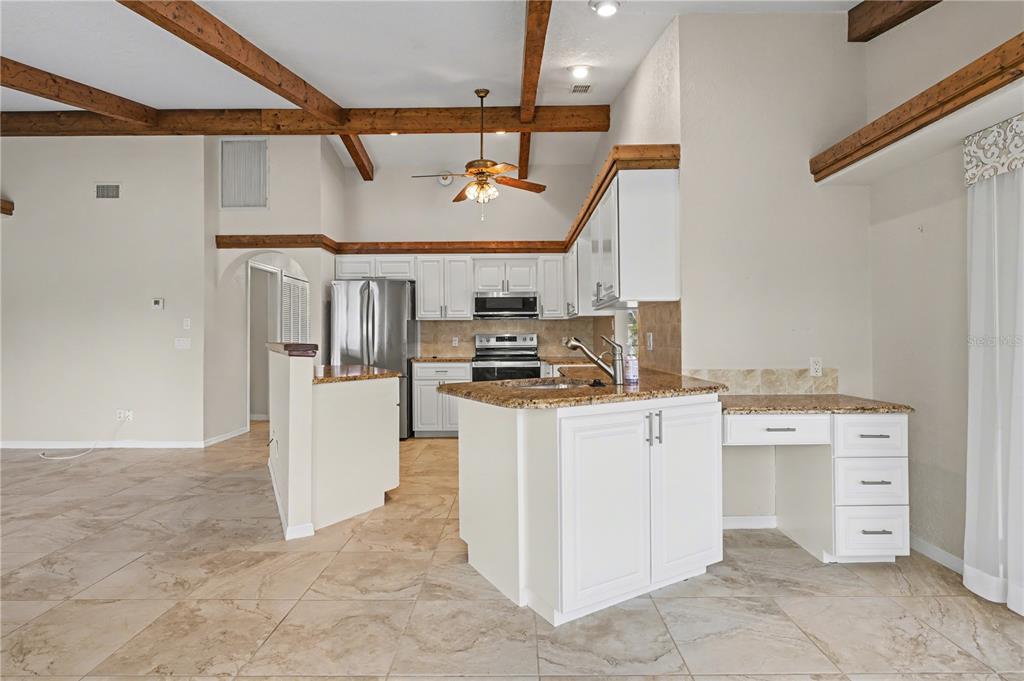 1119 Vía Formia Punta Gorda, FL 33950 - Photo 27 of 58 a kitchen that has a lot of cabinets in it