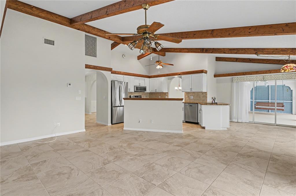1119 Vía Formia Punta Gorda, FL 33950 - Photo 31 of 58 a view of a kitchen with a sink and cabinets