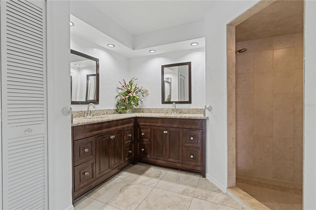 1119 Vía Formia Punta Gorda, FL 33950 - Photo 39 of 58 a bathroom with a granite countertop sink and a mirror
