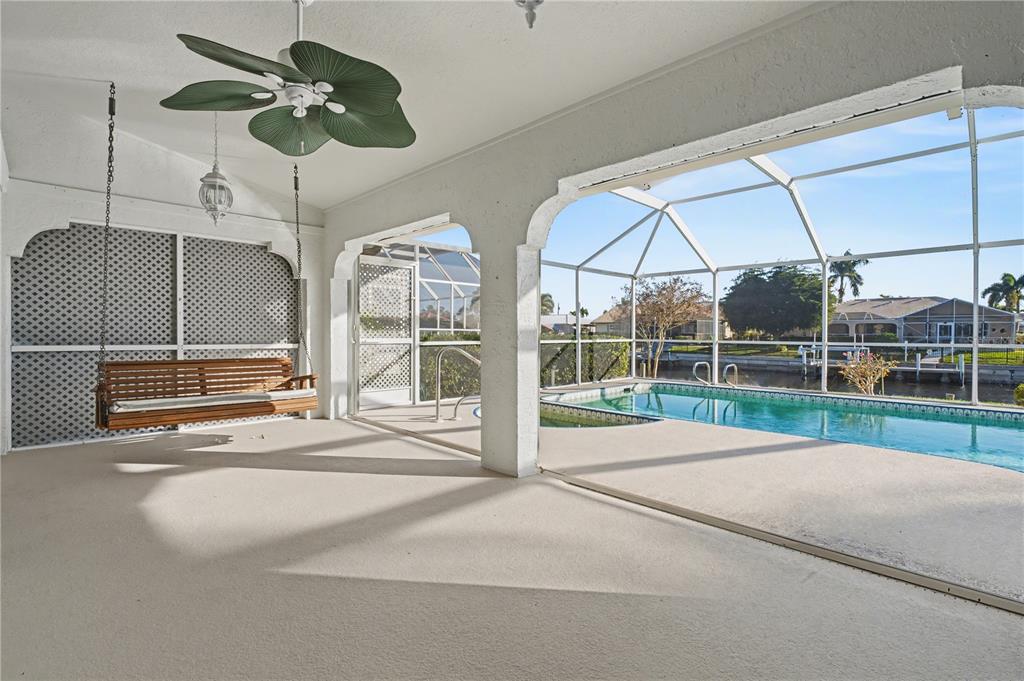 1119 Vía Formia Punta Gorda, FL 33950 - Photo 46 of 58 a view of a room with a large windows and ceiling fan