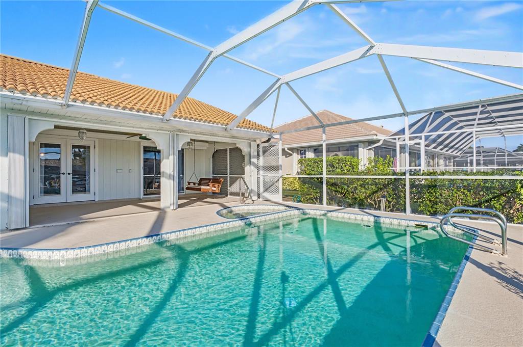 1119 Vía Formia Punta Gorda, FL 33950 - Photo 49 of 58 a view of a house with a backyard porch and sitting area