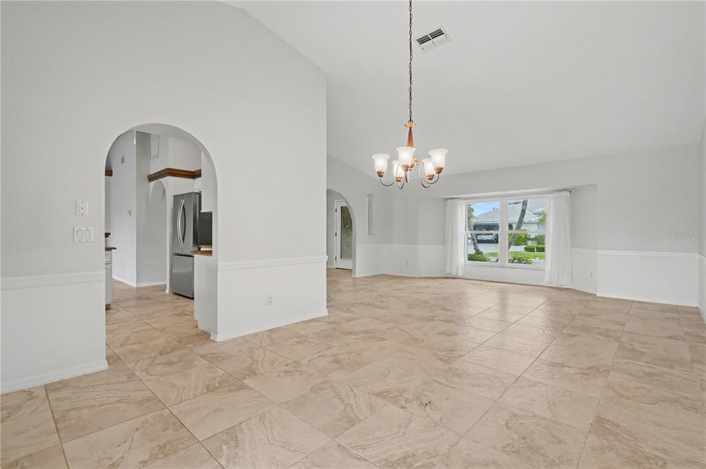 1119 Vía Formia Punta Gorda, FL 33950 - Photo 5 of 58 a view of a room with chandelier and entryway