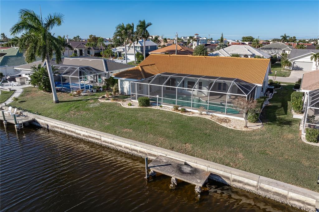 1119 Vía Formia Punta Gorda, FL 33950 - Photo 58 of 58 a view of a house with a yard