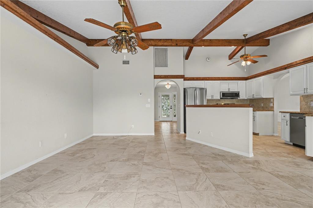 1119 Vía Formia Punta Gorda, FL 33950 - Photo 10 of 58 a view of a kitchen with a sink and cabinets