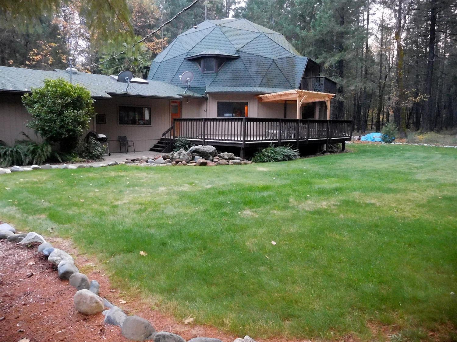 7133 Rockydale Road Cave Junction, OR 97523 - Photo 5 of 23 View of the home from short distance, to