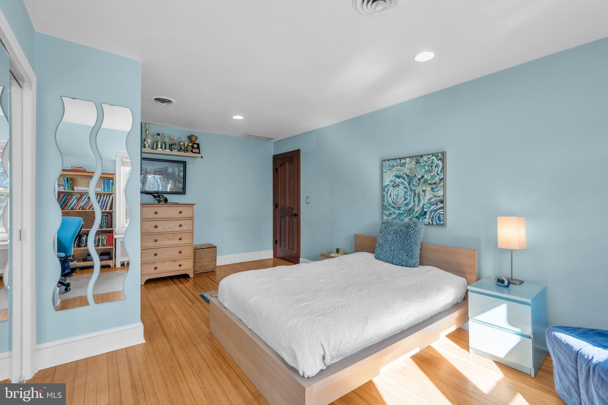 152 Terhune Road Princeton, NJ 08540 - Photo 30 of 42 a bedroom with a large bed and a wooden floor