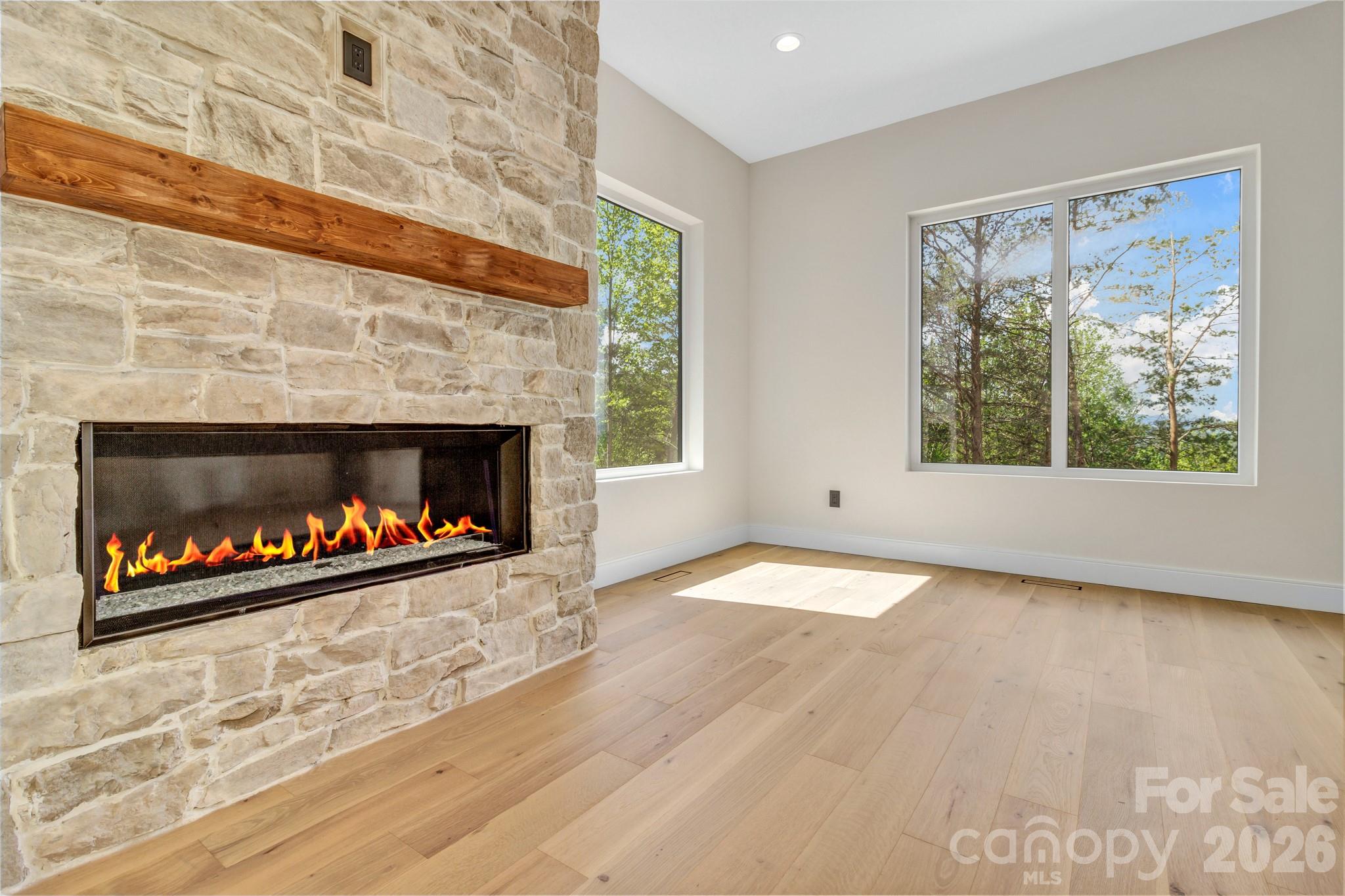 134 View Ridge Parkway Leicester, NC 28748 - Photo 9 of 48 a living room with window and a fireplace