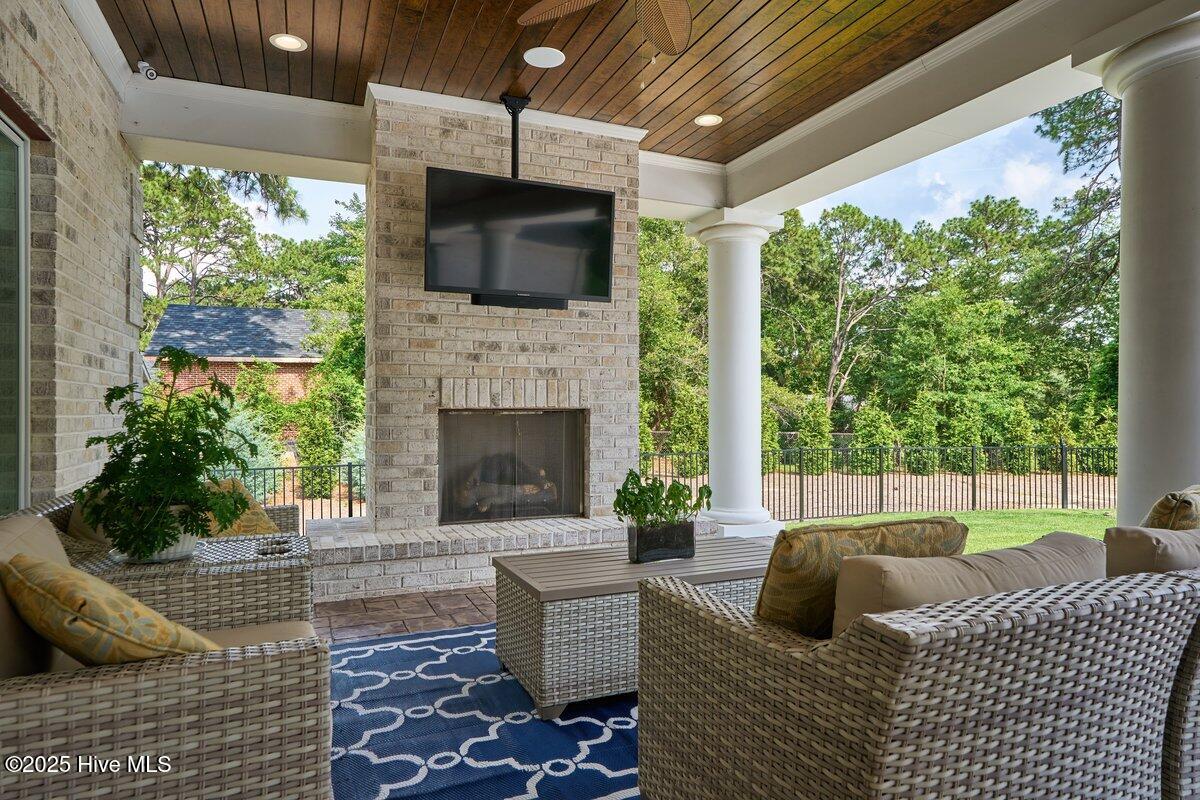 2270 Midland Road Pinehurst, NC 28374 - Photo 78 of 91 Covered porch fireplace
