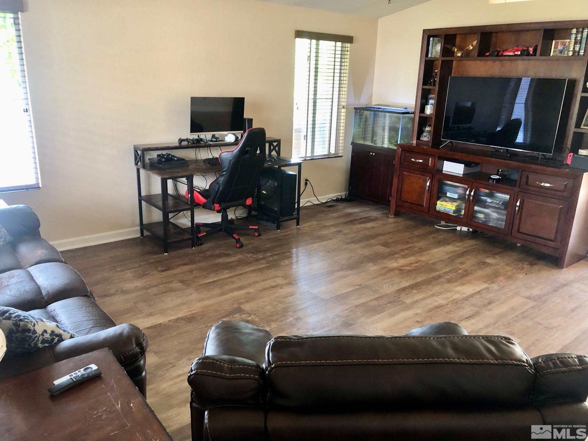 1401 Sandia Court Reno, NV 89523 - Photo 6 of 13 a living room with furniture and a flat screen tv