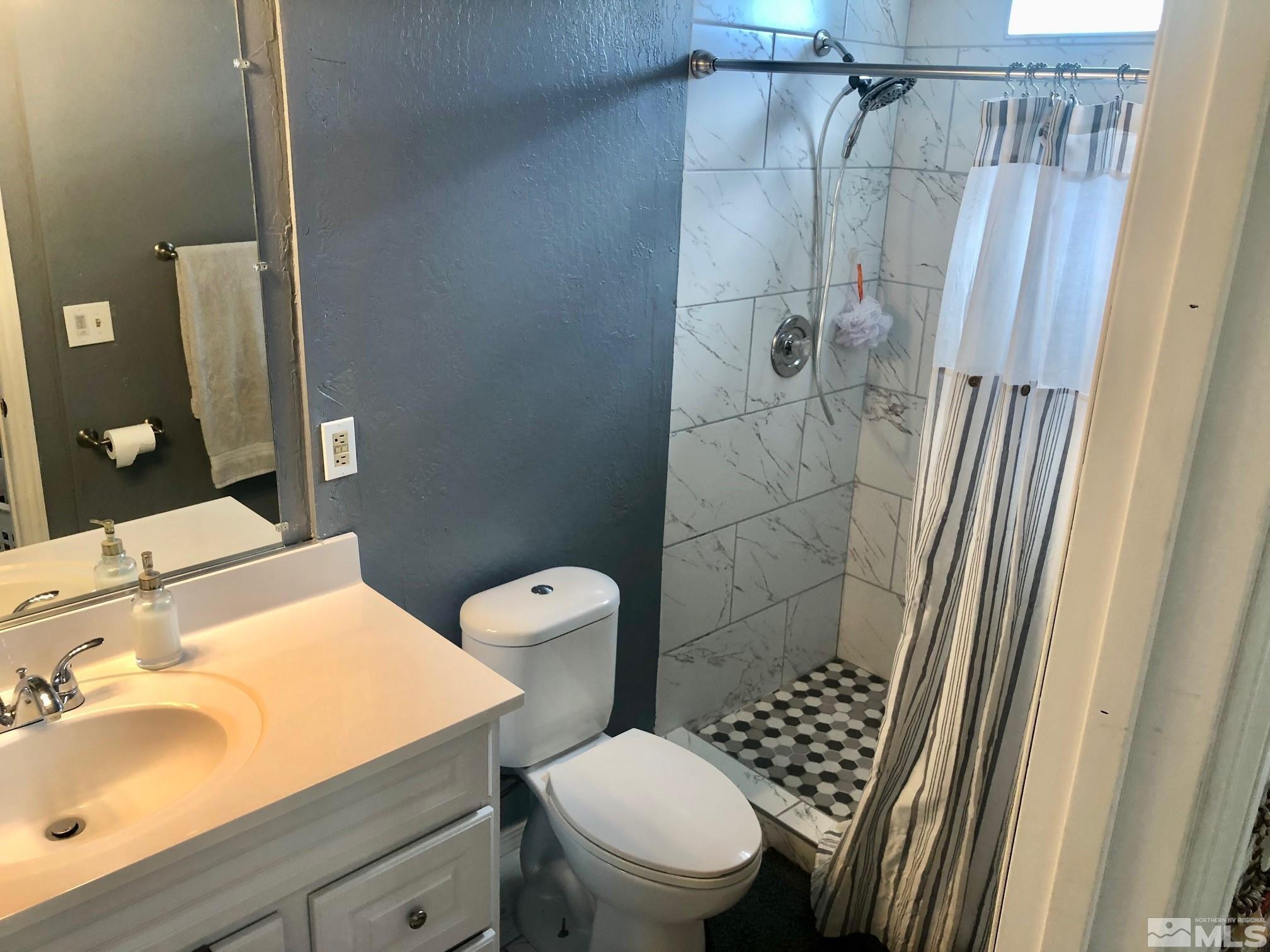 1401 Sandia Court Reno, NV 89523 - Photo 8 of 13 a bathroom with a sink toilet and shower