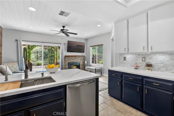 a kitchen with sink cabinets and window