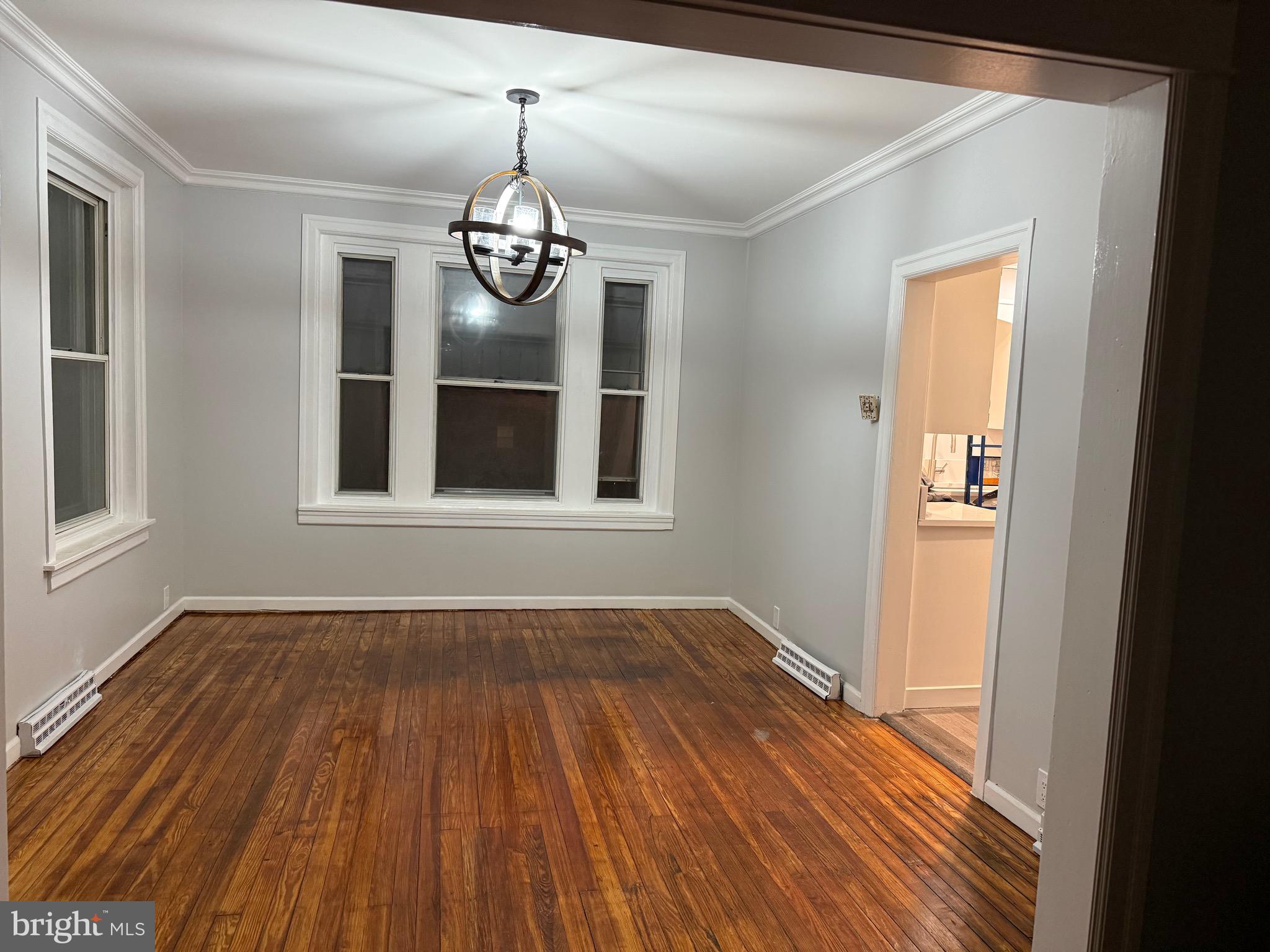 399 Sunset Road Reading, PA 19611 - Photo 6 of 18 a view of an empty room with wooden floor and a window