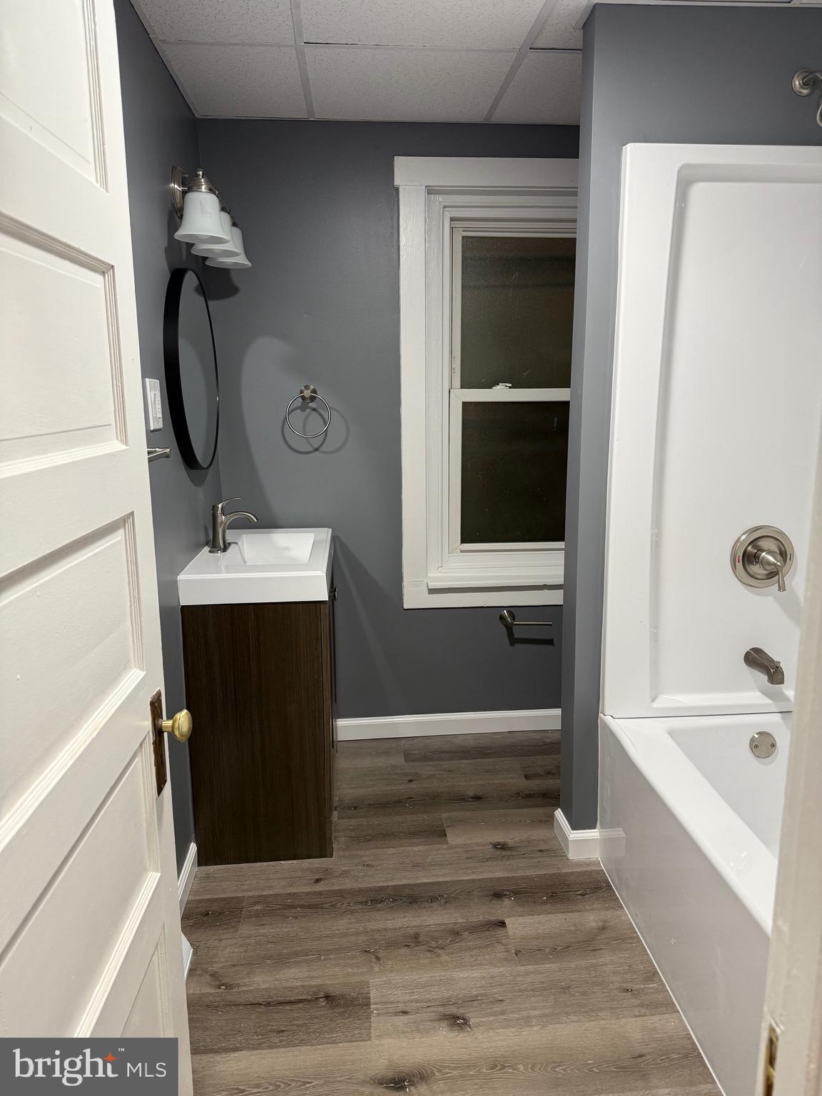 399 Sunset Road Reading, PA 19611 - Photo 8 of 18 a bathroom with a tub sink and mirror