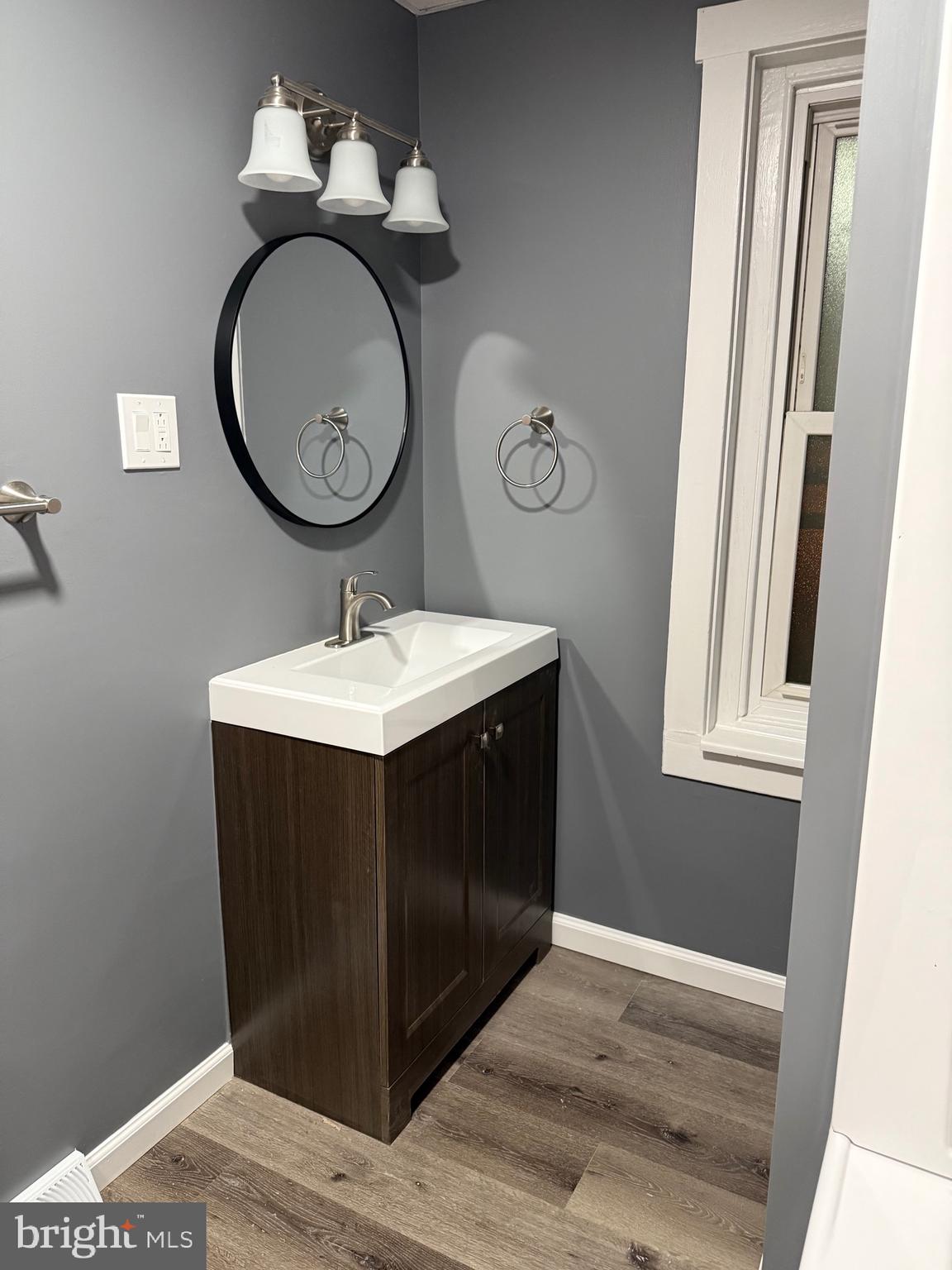 399 Sunset Road Reading, PA 19611 - Photo 10 of 18 a bathroom with a sink vanity and a mirror