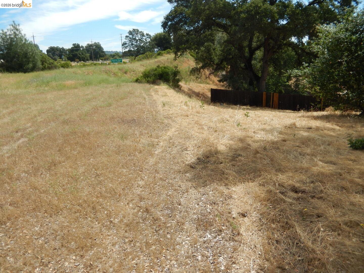 512 Crazy Horse Road Cameron Park, CA 95682 - Photo 13 of 18 a view of a yard with a house