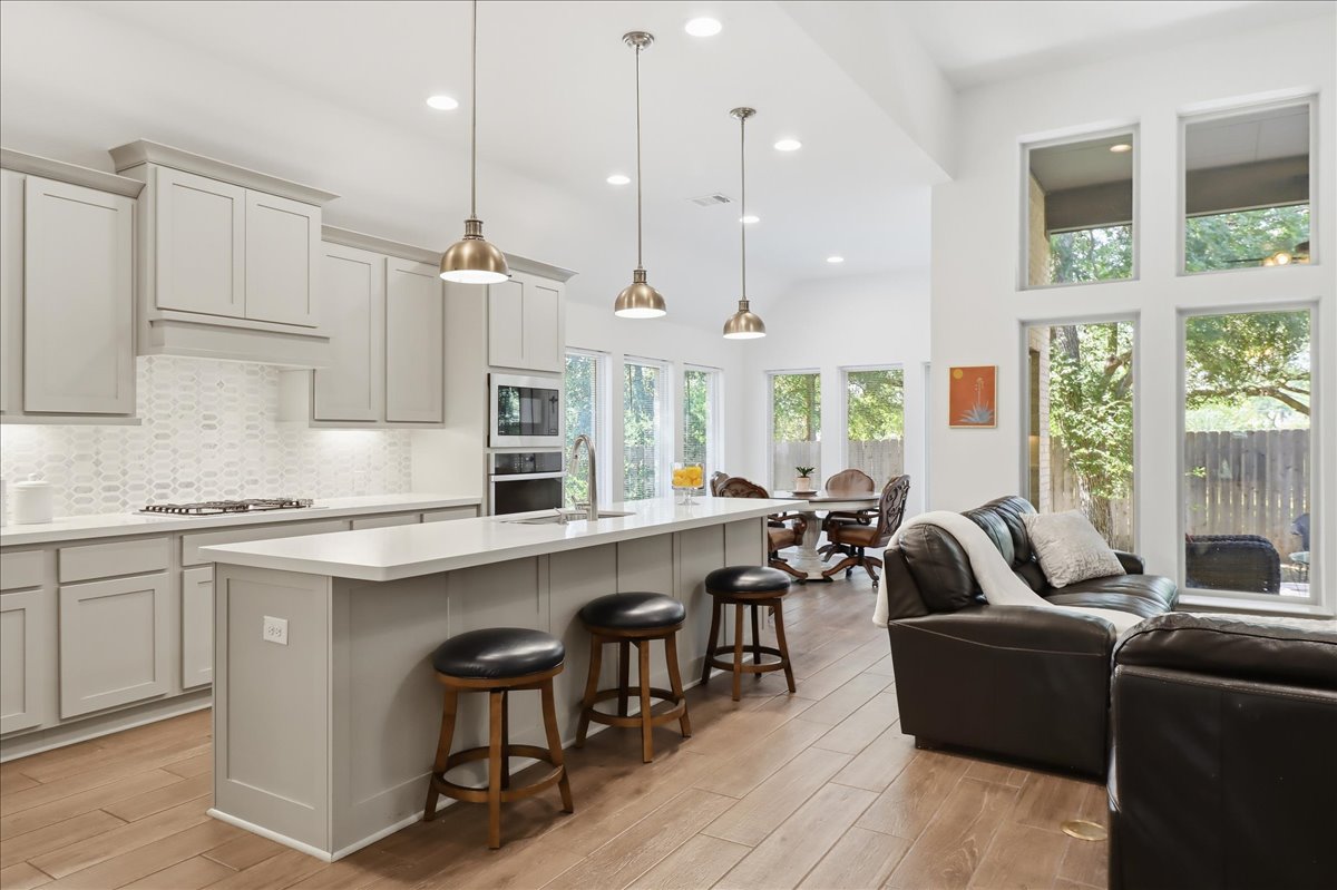 109 Rock Dock Road Georgetown, TX 78633 - Photo 22 of 39 Large kitchen island is open to family room.