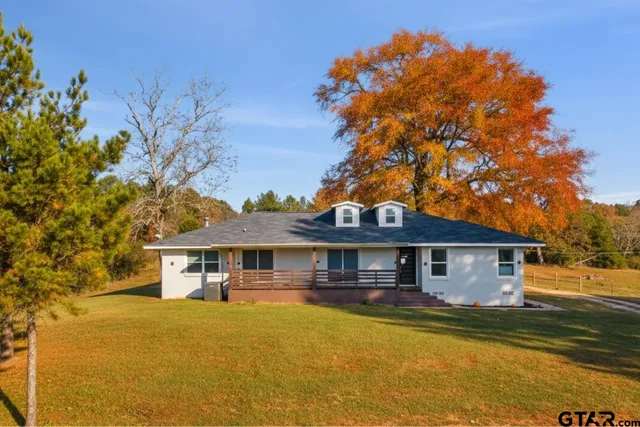 a front view of a house with swimming pool