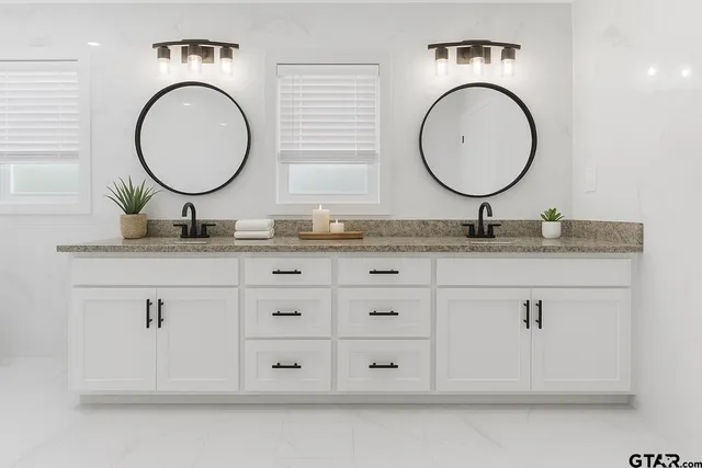 an empty room with a ceiling fan and a window