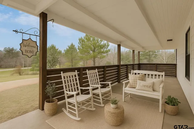 a kitchen with granite countertop a white refrigerator oven a sink dishwasher and white cabinets with wooden floor