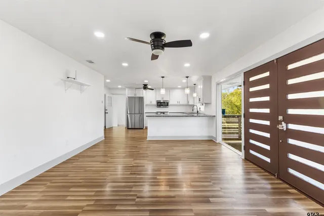 a bedroom with a bed and a couch