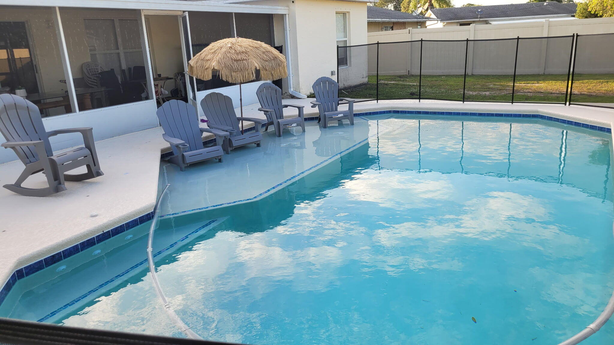 365 Northwest Hibiscus Street Port St. Lucie, FL 34983 - Photo 3 of 8 a view of a chairs and table in patio