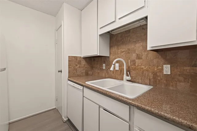 a close view of a sink and a vanity in the bathroom