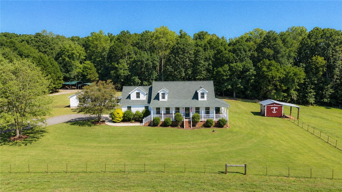 2420 Rainey Road Starr, SC 29684 - Photo 1 of 36 A spacious country home anchors this sprawling acreage bordered by a dense forest.