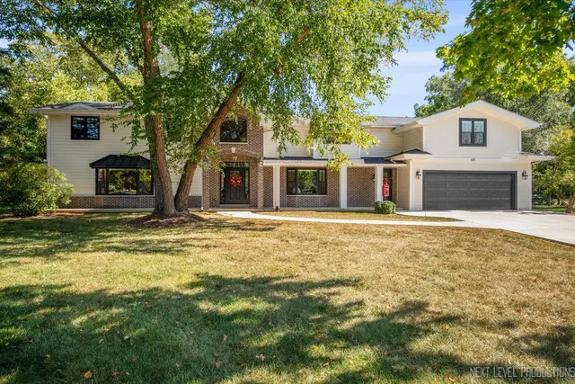 a house with swimming pool in front of it