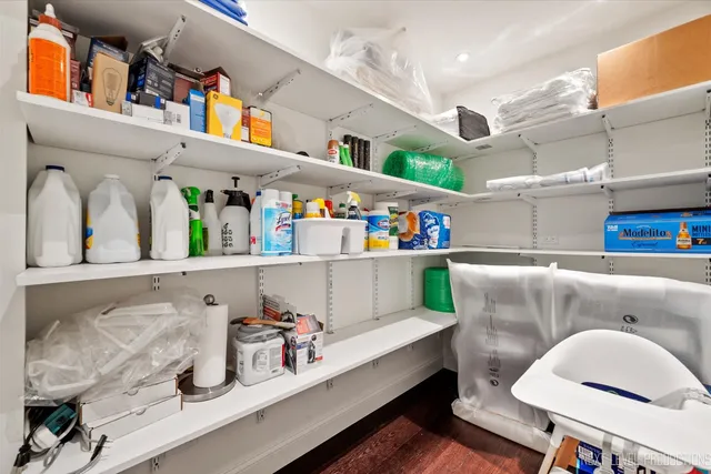 a kitchen with a refrigerator and a sink
