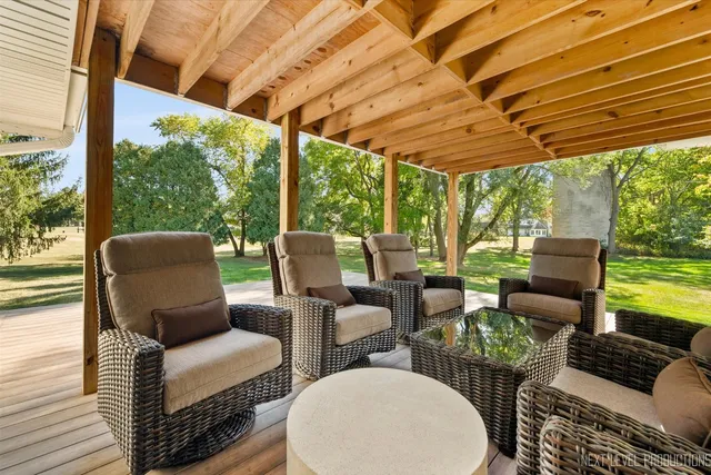a outdoor living space with patio furniture and garden view