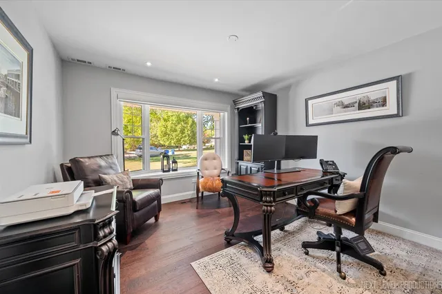 a work room with furniture and a window