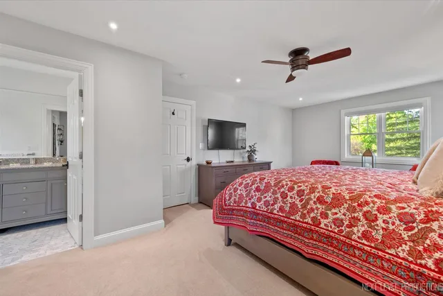 a bed room with a bed and a television