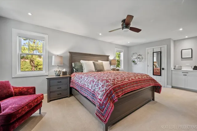 a spacious bedroom with a bed and window