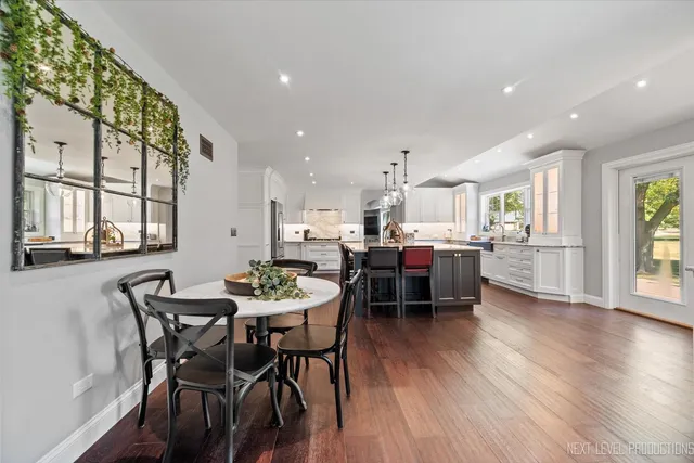 a view of a dining room with furniture and wooden floor